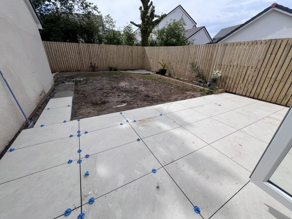 a backyard with a fence and a fence