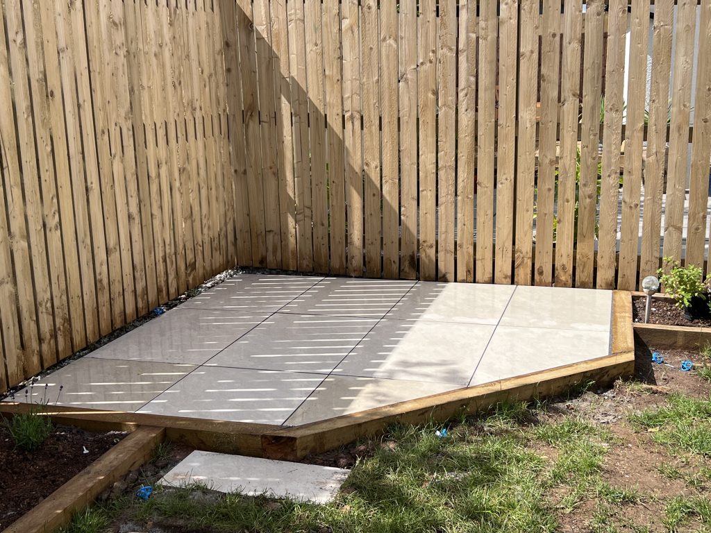 a wooden fence with a tile floor