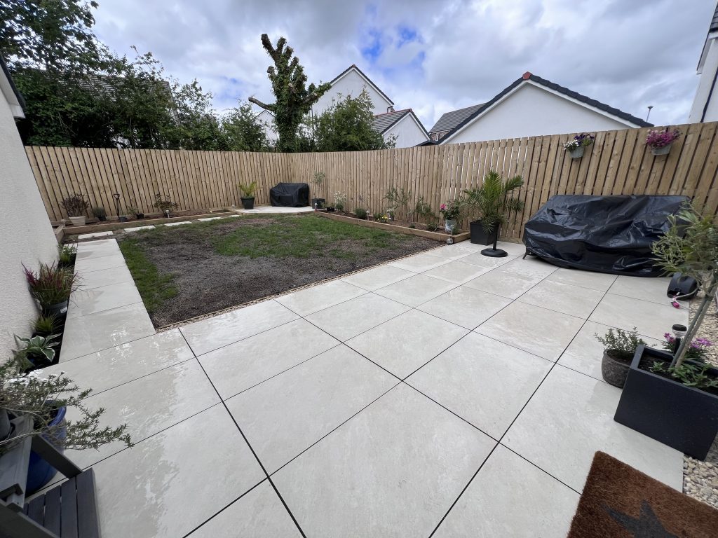 a backyard with a fence and a fence