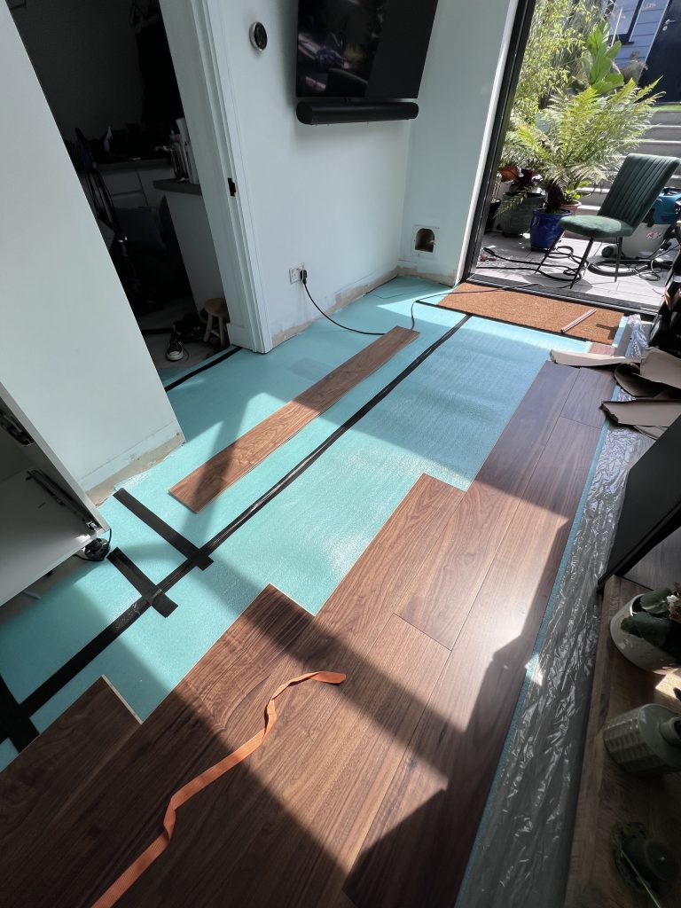 a room with a blue floor and a wood floor